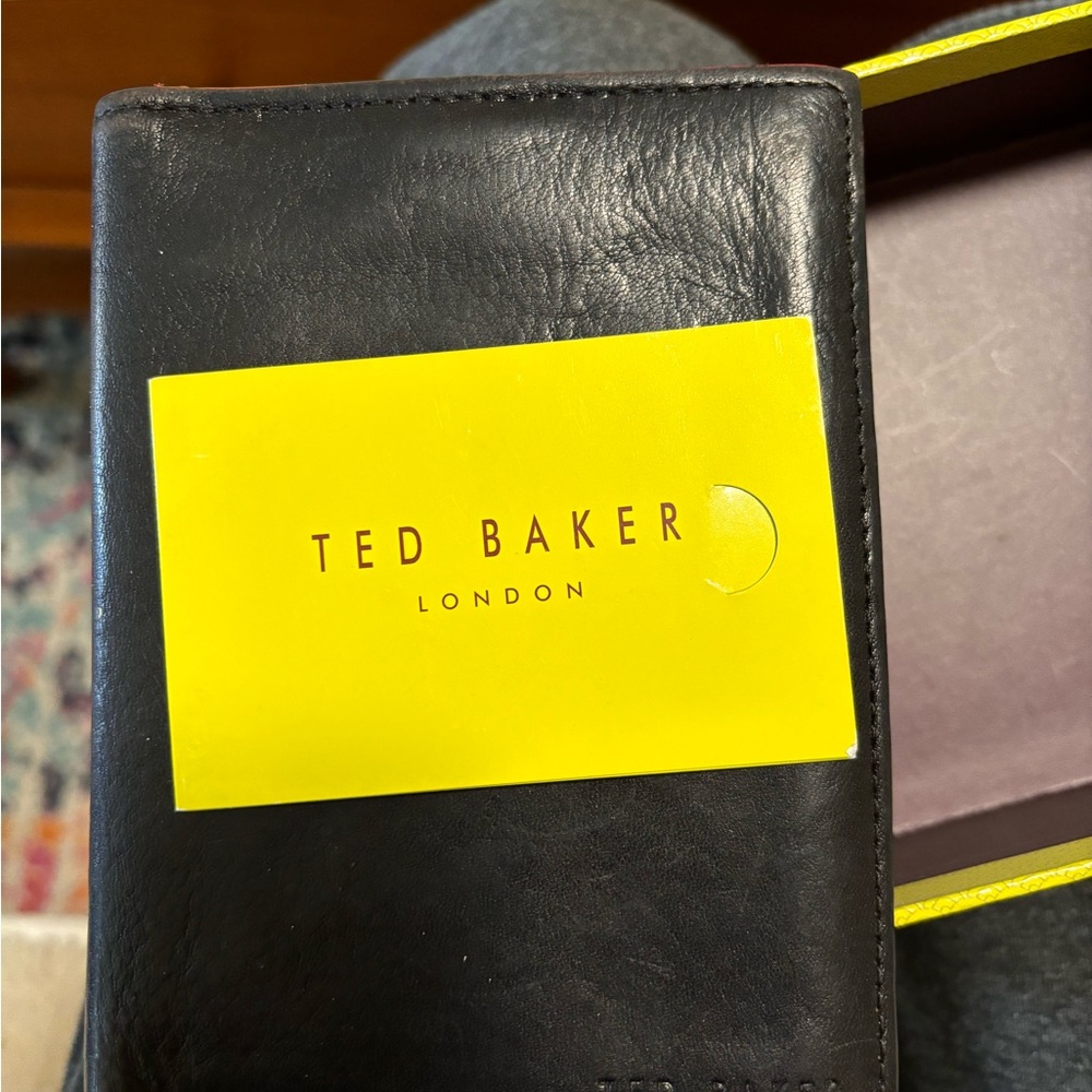 Me s Ted baker wallet used but in good condition black in color with red trim